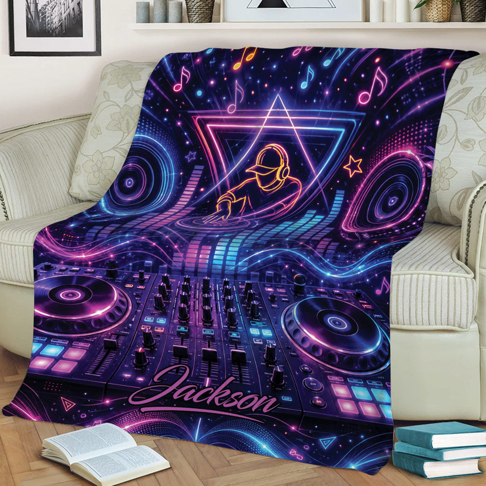 Colorful DJ throw blanket displayed on a sofa with glowing turntables, mixer controls, and musical notes