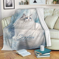 Ragdoll cat blanket draped over a sofa with soft blue watercolor cat artwork