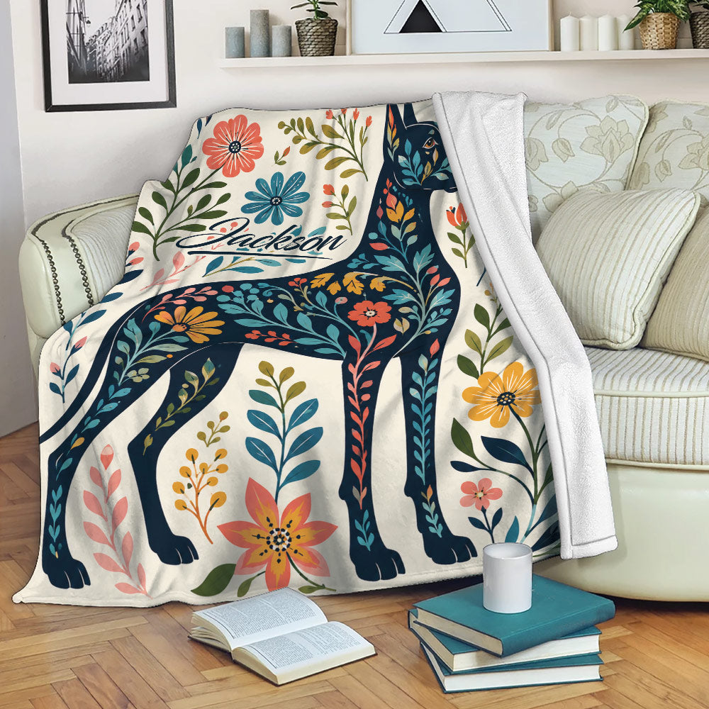Floral Great Dane blanket draped over a living room sofa with colorful botanical artwork