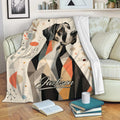 Great Dane throw blanket displayed on a sofa with modern geometric artwork