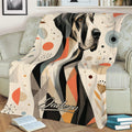 Great Dane blanket draped over a sofa, featuring bold abstract dog artwork