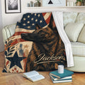 Dutch Shepherd throw blanket displayed on a couch with vintage patriotic artwork and a cozy reading setting