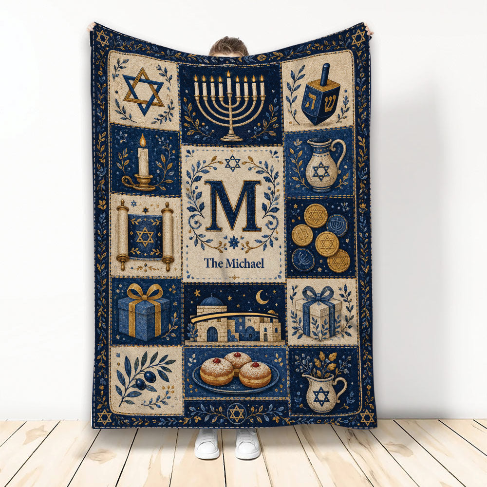 Hanukkah blanket displaying menorahs, dreidels, Stars of David, gifts, candles, and Jewish holiday artwork