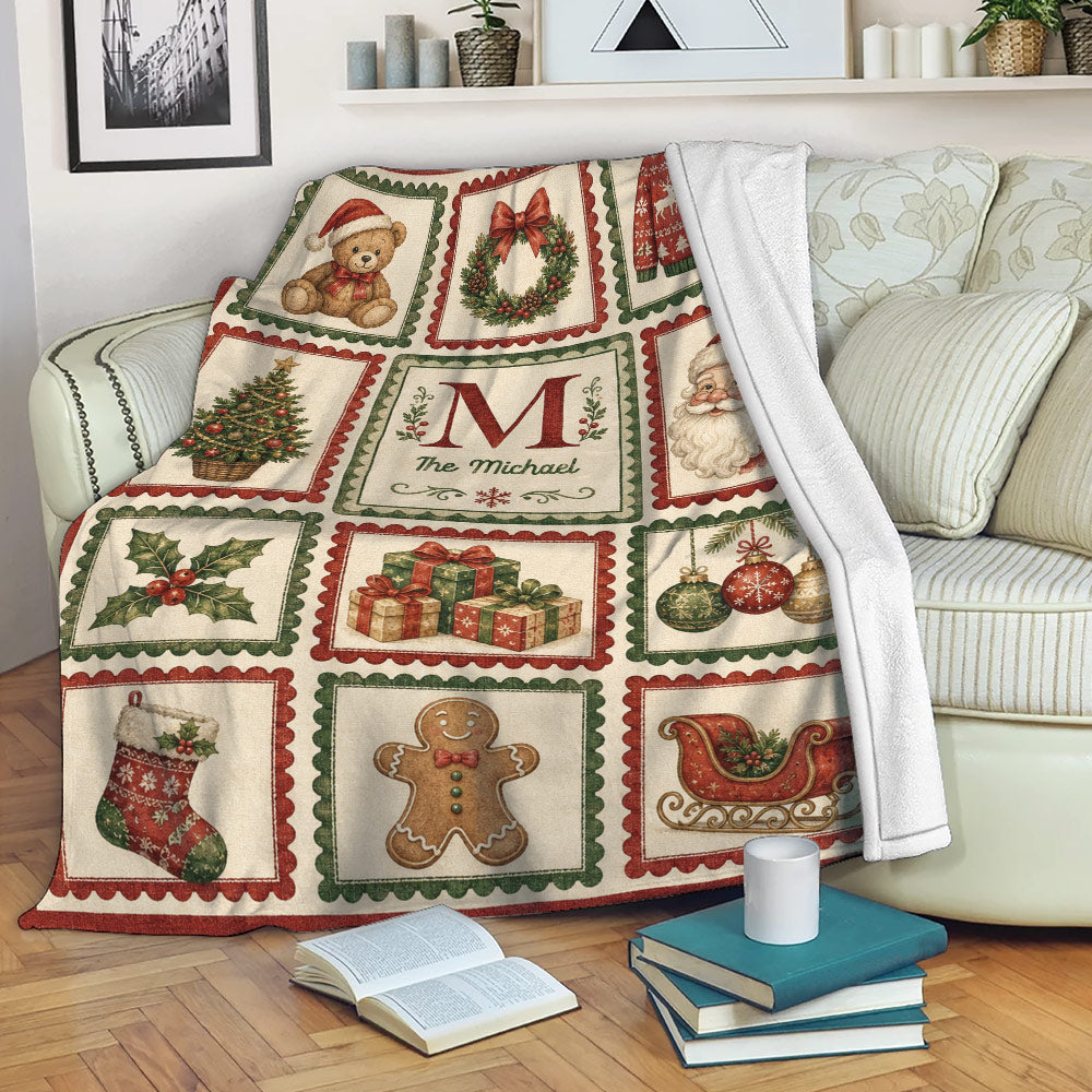 Vintage Christmas blanket draped over a sofa with Santa, presents, ornaments, stockings, and holiday tree panels