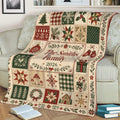 Christmas throw blanket draped over a sofa with rustic holiday patchwork design