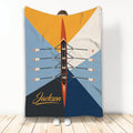 Rowing throw blanket with overhead racing shell, oars, and bold geometric blue, orange, and navy design