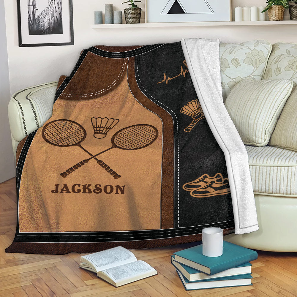 Badminton blanket draped over a sofa with racket, shuttlecock and athletic shoe illustrations