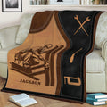 Close view of an ironworker throw blanket on a sofa with structural steel and hand tool illustrations
