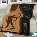 Close view of an archery throw blanket featuring a detailed archer silhouette and target design
