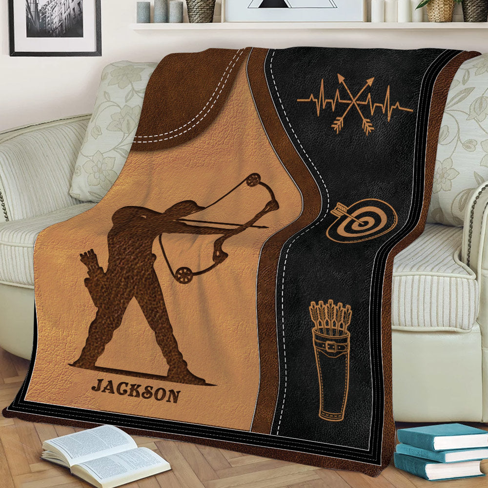 Close view of an archery throw blanket featuring a detailed archer silhouette and target design