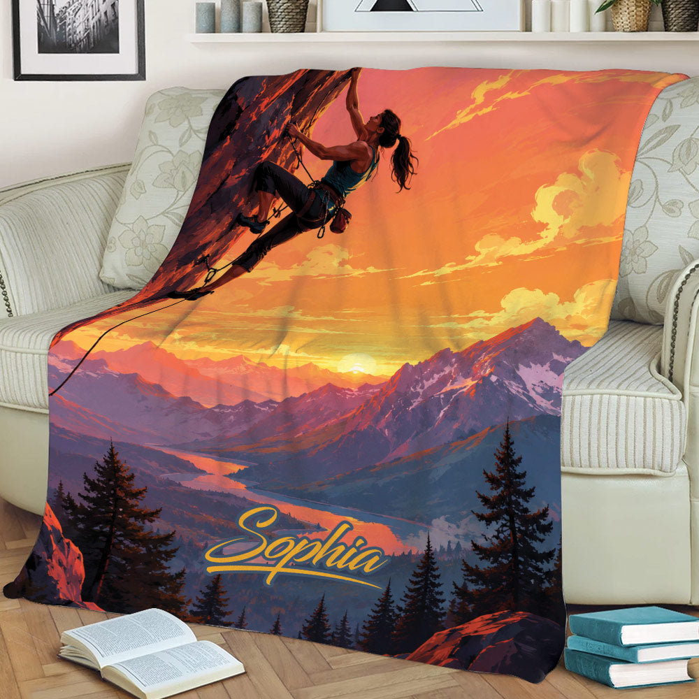 Mountain climbing blanket draped over a couch with colorful alpine scenery and climber design