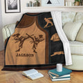 Taekwondo throw blanket displayed on a sofa with martial arts figures, uniforms, and belt-themed artwork