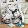 Taekwondo blanket draped over a sofa with black, white, and red martial arts artwork