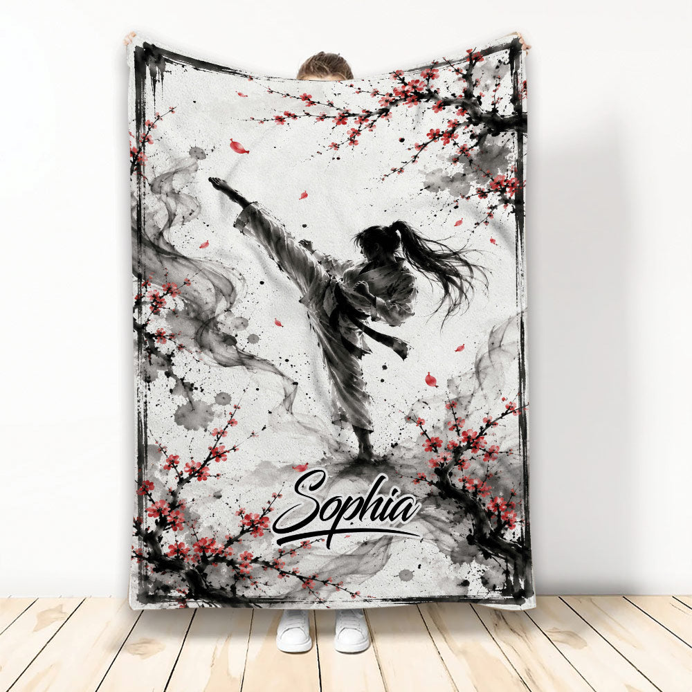 Taekwondo throw blanket with high-kicking martial artist and red blossom ink artwork