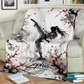 Taekwondo throw blanket displayed on a couch with dynamic martial artist and blossom design