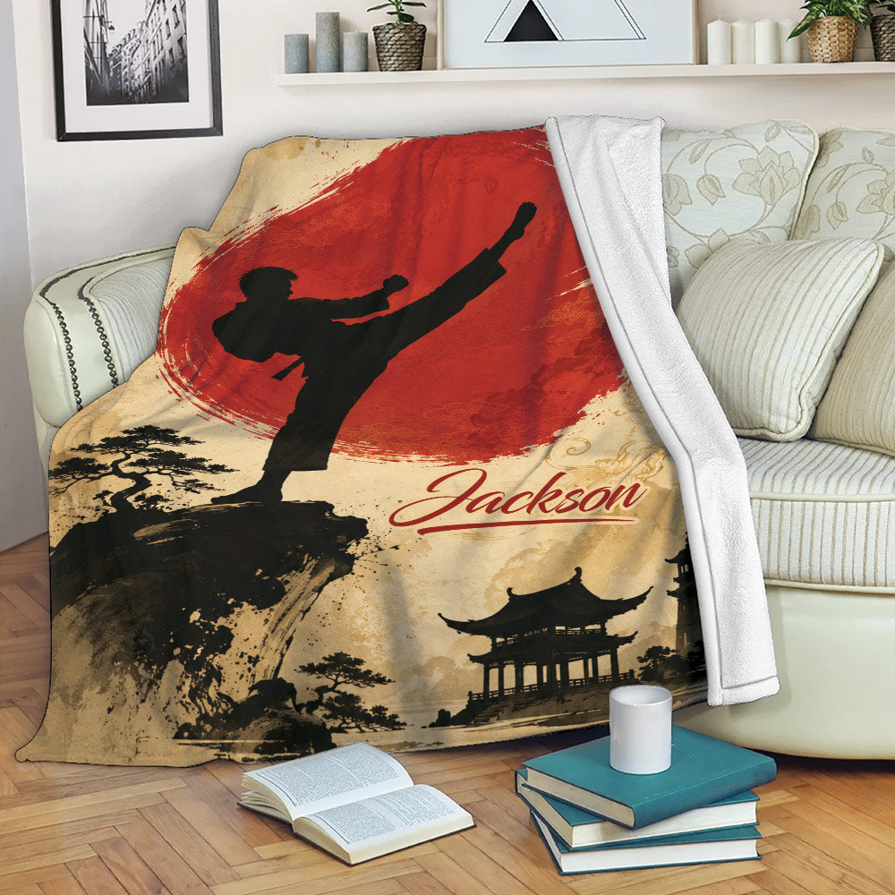Taekwondo throw blanket displayed on a sofa with martial arts silhouette, red artwork, and scenic temple design