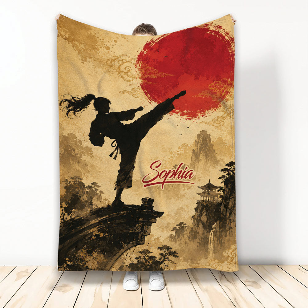 Taekwondo throw blanket with high-kicking martial artist silhouette, red sun, and Asian-inspired landscape