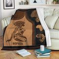 African woman throw blanket draped over a sofa with coordinated portrait and heritage artwork