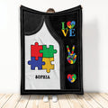 Autism throw blanket with colorful puzzle pieces, heart motifs, and black-and-white acceptance artwork