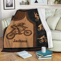 BMX throw blanket displayed on a sofa with freestyle bicycle rider artwork and black border