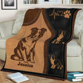 Close view of Border Collie blanket on a sofa featuring illustrated dogs and a paw print motif