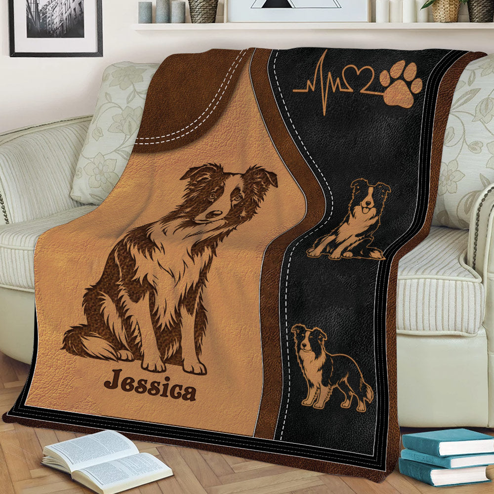 Close view of Border Collie blanket on a sofa featuring illustrated dogs and a paw print motif