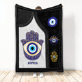 Evil Eye throw blanket with Hamsa hand artwork in black, white, blue, and gold