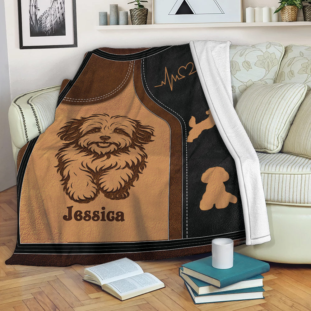 Havanese throw blanket draped over a sofa with cozy dog artwork and paw print accents
