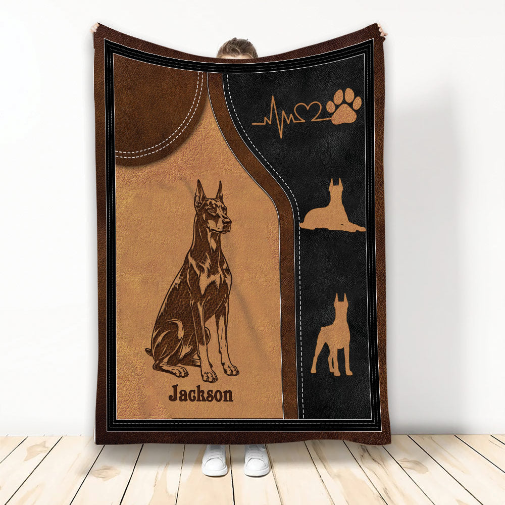 Doberman throw blanket featuring brown and black dog artwork, paw print, heartbeat, and silhouette details