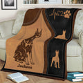 Close view of a Doberman blanket with detailed dog illustration, paw print, and heartbeat design