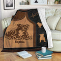 Staffordshire Bull Terrier throw blanket displayed on a sofa with sepia dog artwork and paw motifs