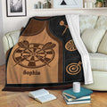 Rustic dart board throw blanket draped over a sofa with dartboard and darts design