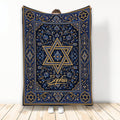 Hanukkah throw blanket with ornate blue and gold Star of David artwork displayed upright