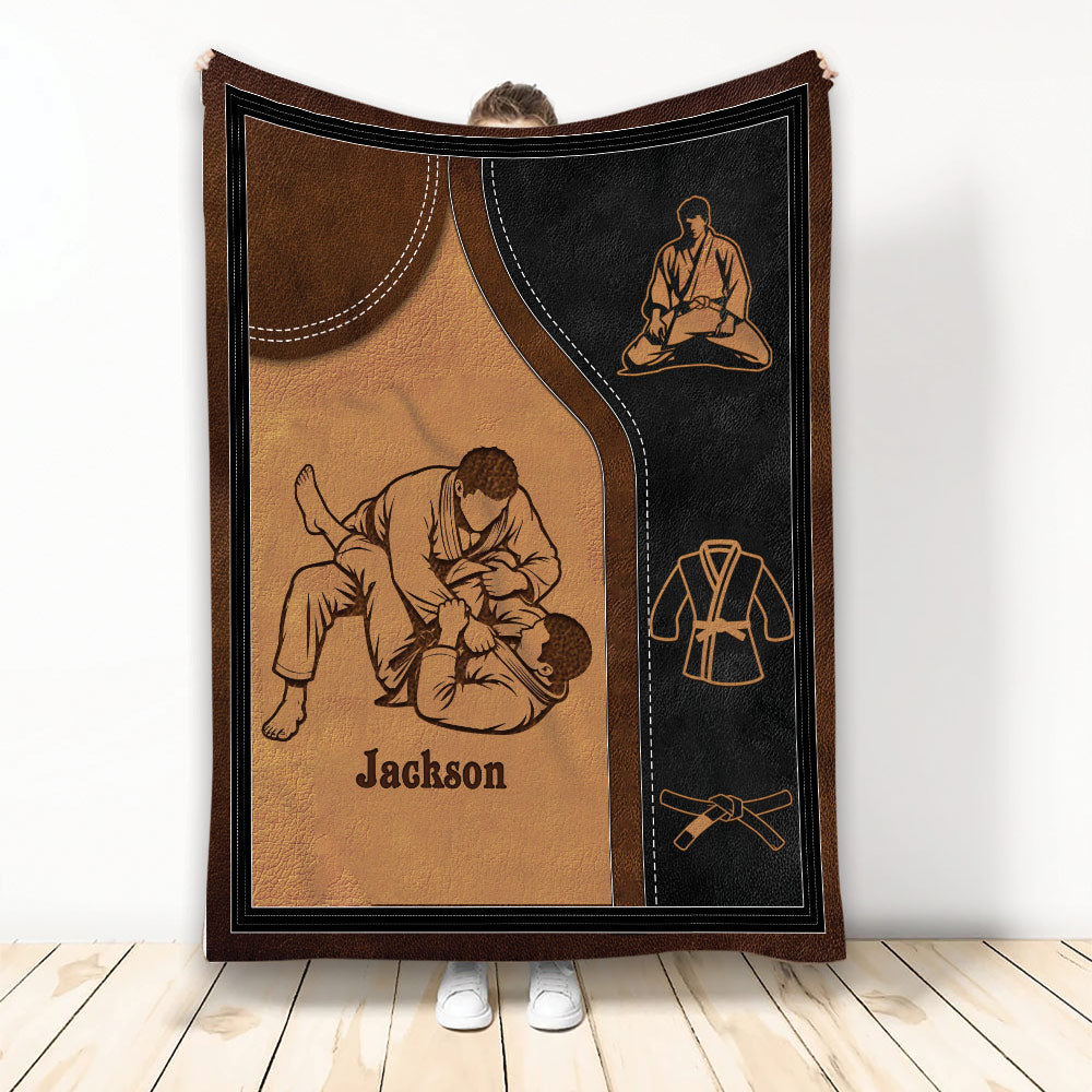 Jiu Jitsu blanket featuring grappling artwork, martial arts belts, and a black and brown design
