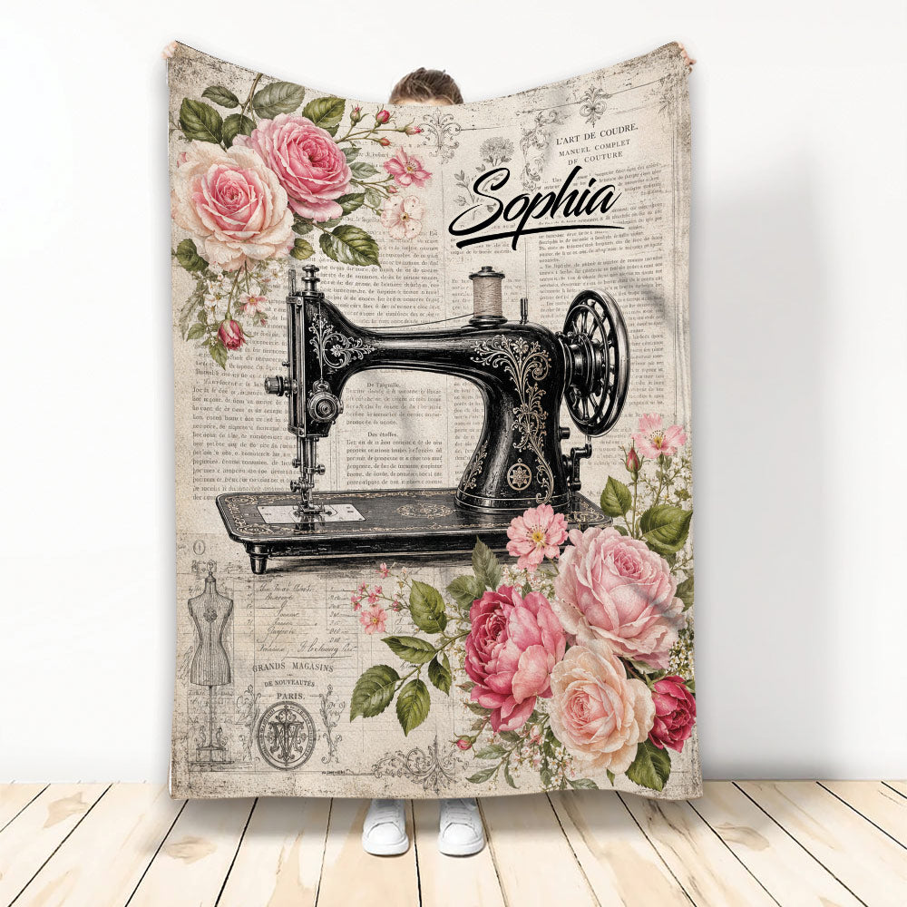 Vintage sewing blanket featuring an ornate black sewing machine, roses, floral accents, and antique-inspired artwork