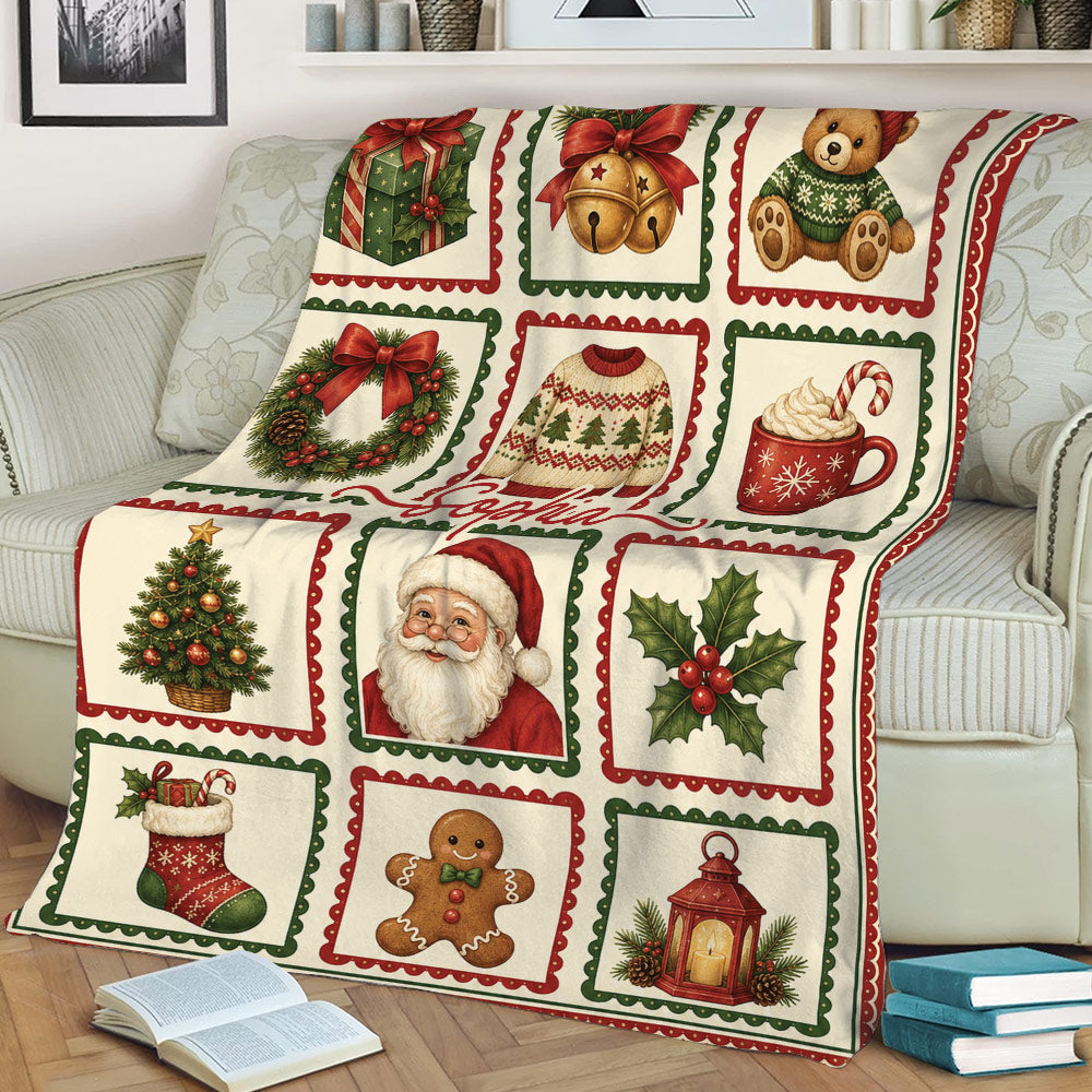 Christmas holiday blanket draped over a couch with Santa, Christmas tree, wreath and gingerbread artwork