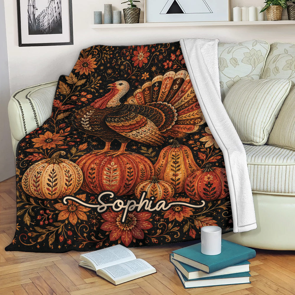 Thanksgiving turkey blanket draped over a sofa with pumpkins, autumn florals, and cozy seasonal colors