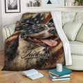 Staffordshire Bull Terrier blanket draped across a sofa with patriotic artwork