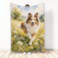Sheltie throw blanket with a watercolor dog running through a bright meadow of daisies