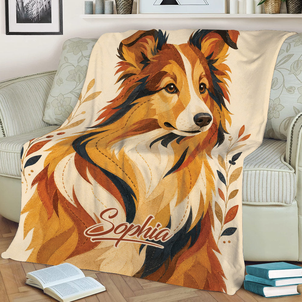 Close view of a Sheltie blanket with detailed golden, cream, and rust dog artwork
