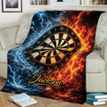 Dart board throw blanket displayed across a couch with lightning, water, and flame artwork