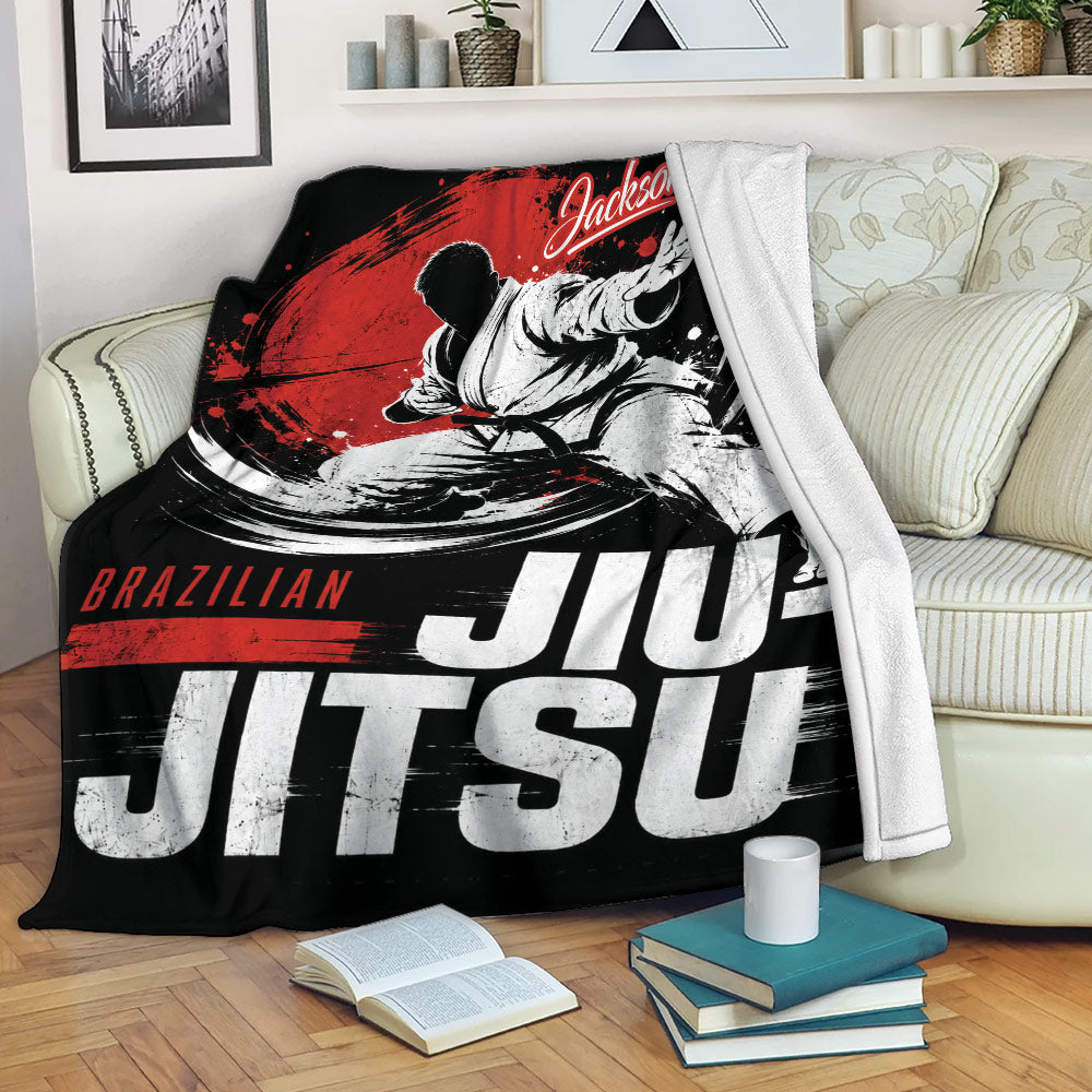 Jiu Jitsu blanket draped over a sofa with dynamic grappling artwork and bold typography