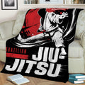 Brazilian Jiu Jitsu throw blanket displayed on a couch with dramatic grappler artwork
