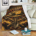 Miner throw blanket displayed on a couch with vintage hard hat and mining tool artwork