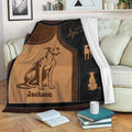 Greyhound throw blanket draped over a sofa with warm vintage artwork and a cozy living room setting