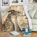 Greyhound throw blanket draped over a sofa with elegant botanical and geometric artwork