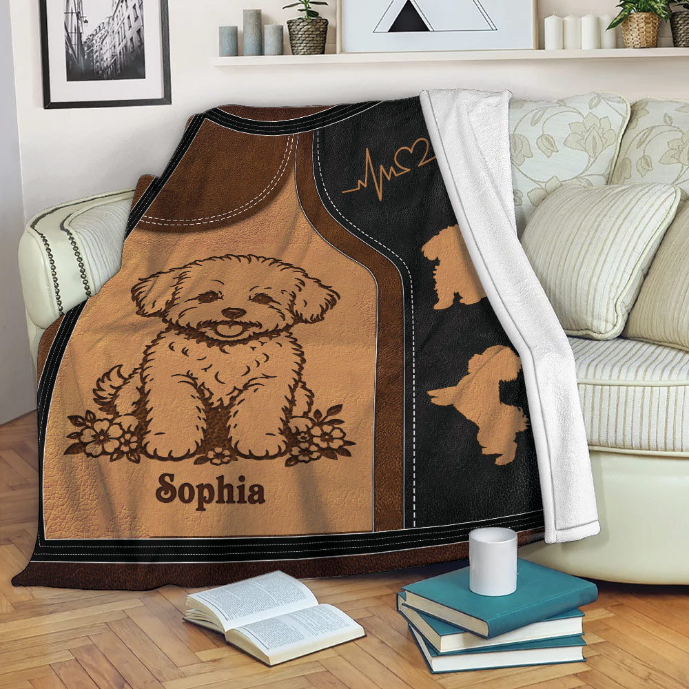 Bichon Frise throw blanket draped over a sofa with warm brown and black dog artwork