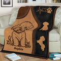 Close view of Bichon Frise blanket design with playful dog silhouettes and paw print detail