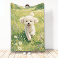 Bichon Frise blanket featuring a cheerful white dog running through a colorful wildflower meadow