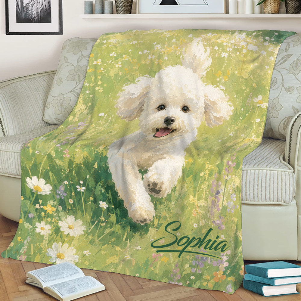Bichon Frise blanket displayed on a sofa with a smiling white dog surrounded by meadow flowers
